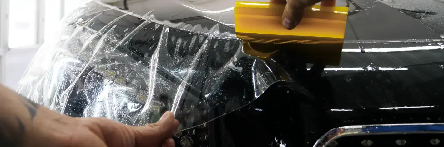 protective layer being added to car