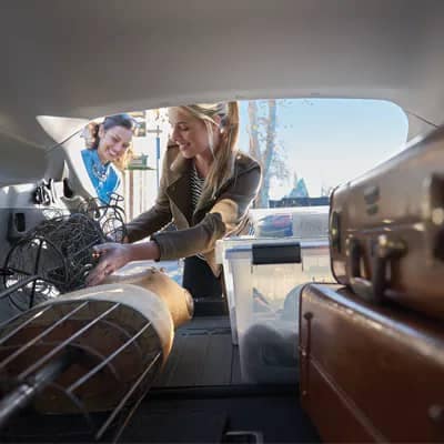 Subaru Crosstrek woman looking in the interior cargo space