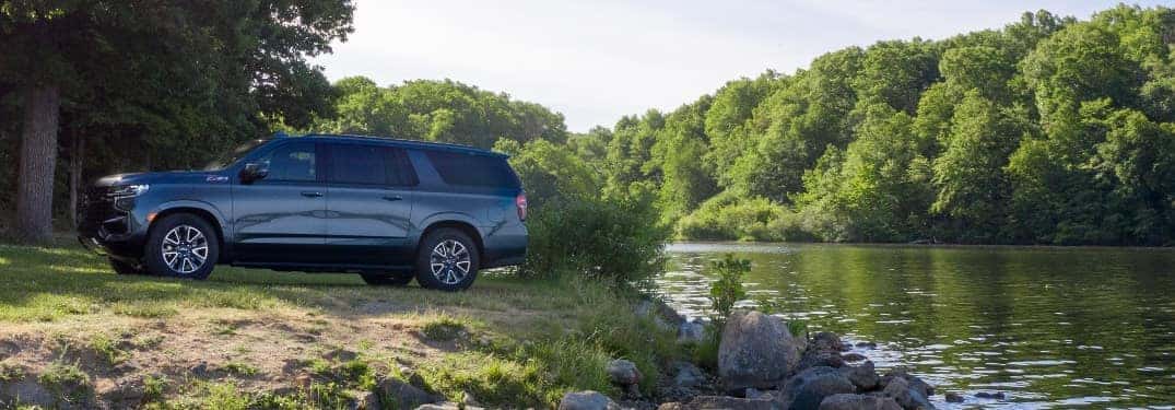 2021 Chevrolet Suburban parked by a stream
