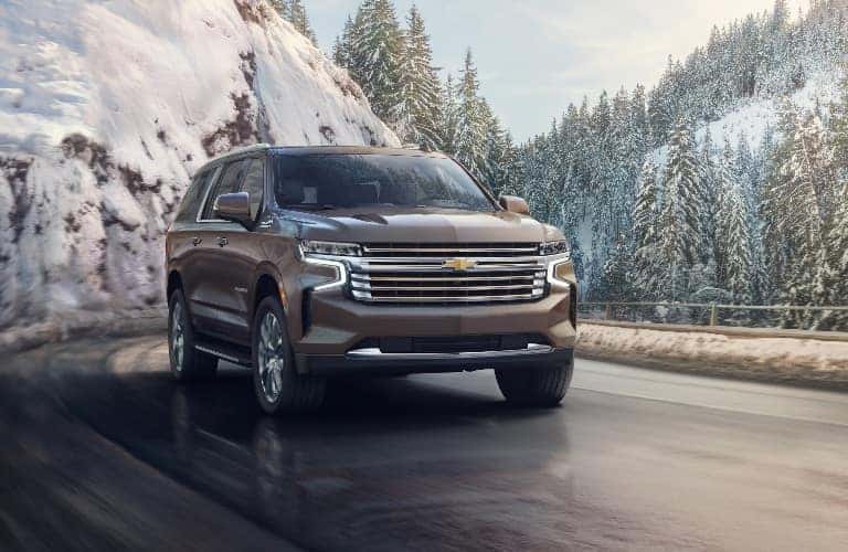 2021 Chevrolet Suburban with snow covered trees in the background