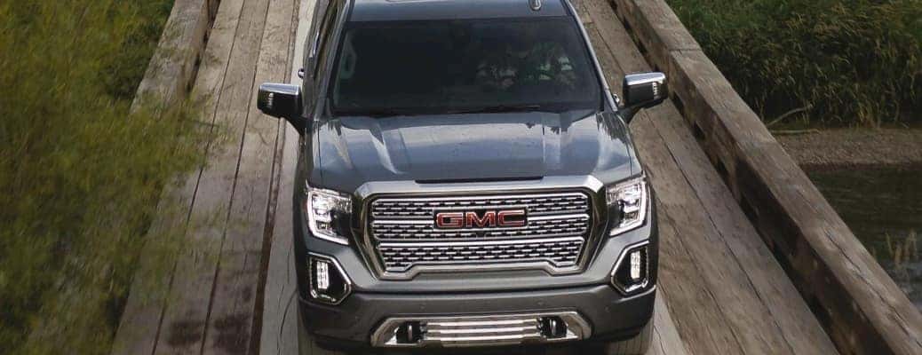 2021 GMC Sierra 1500 Denali going down a wooden road