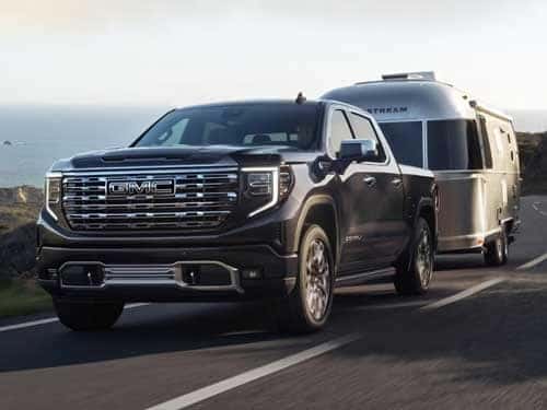 2023 GMC SIERRA 1500 DENALI towing a camper