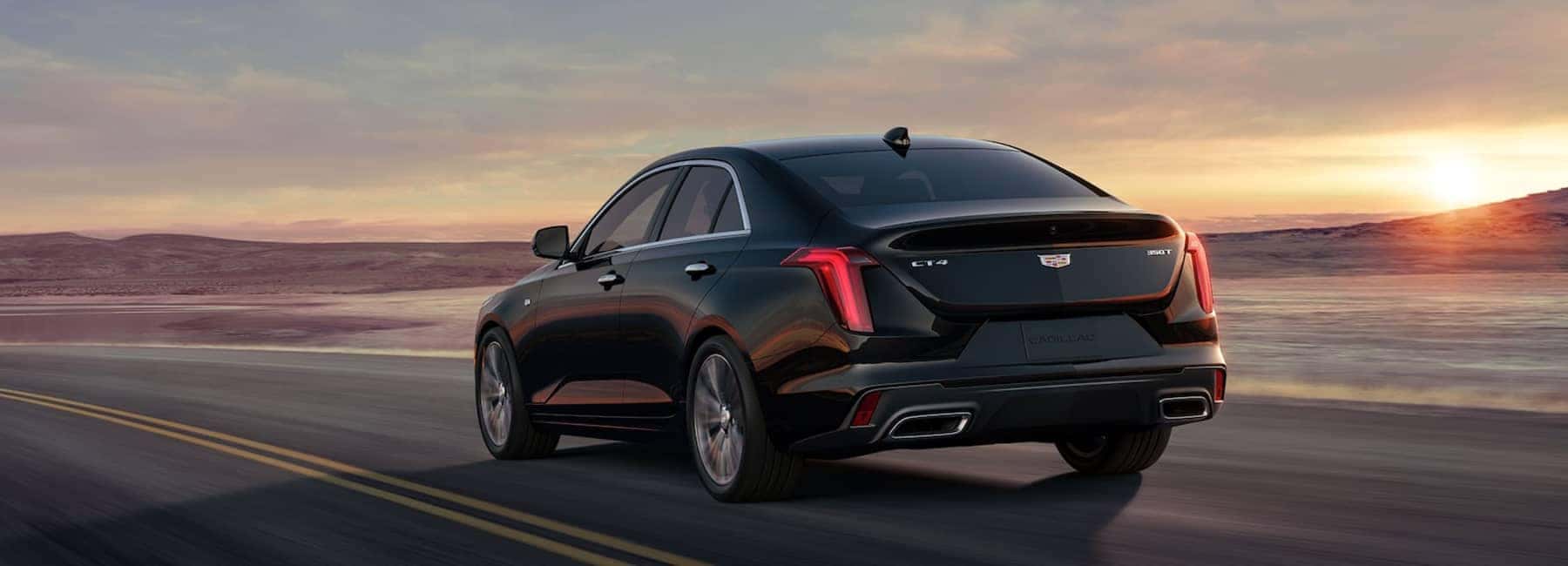 2023 CT4 driving down desert road - rear view