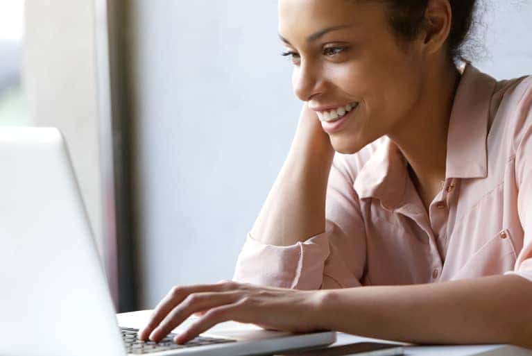 person-looking-online-on-a-laptop
