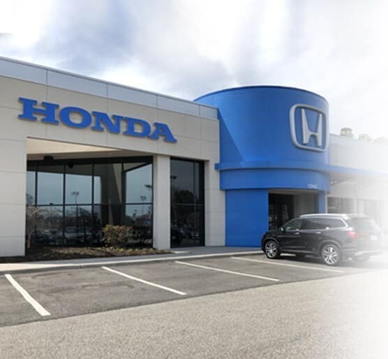 Why Choose Us - exterior view of dealership entrance