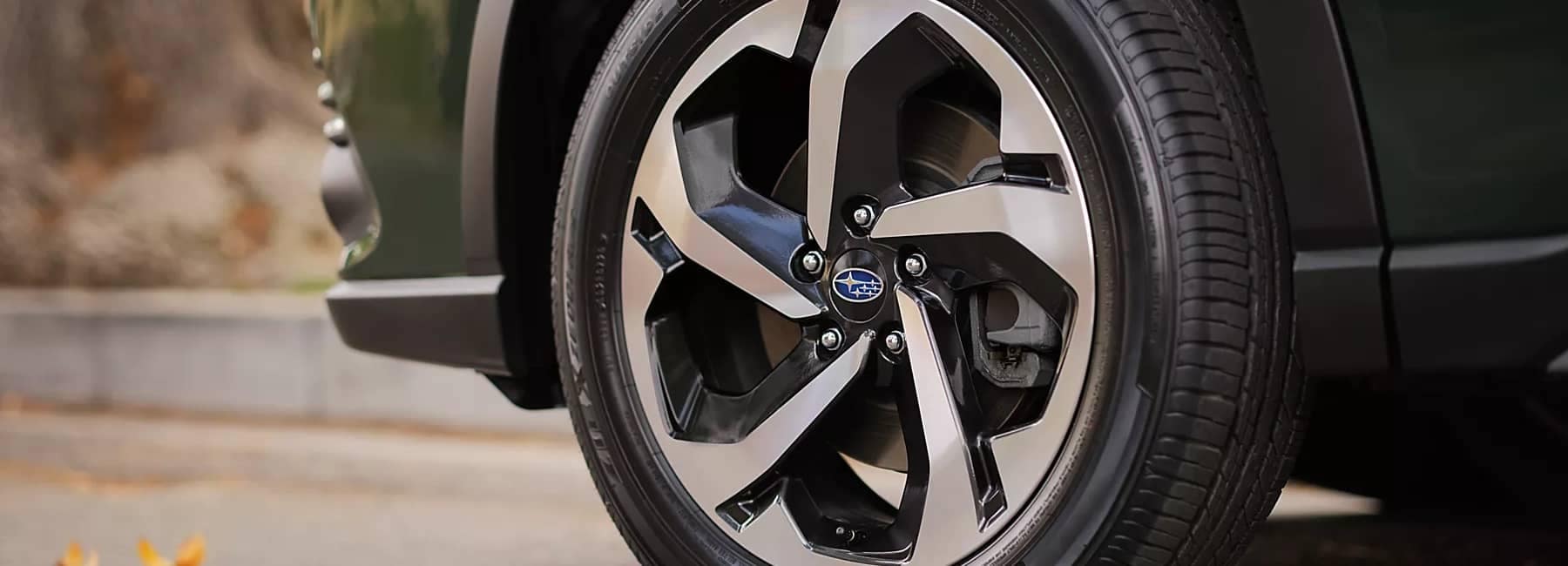 2022 Subaru Forester- closeup view-of front tire at angle-green