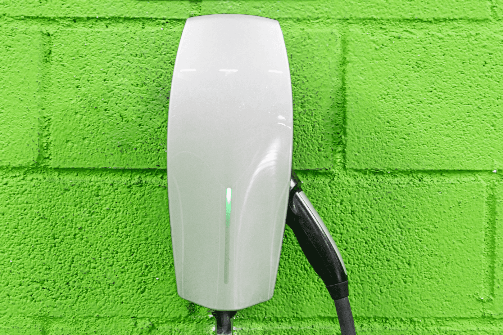 electric vehicle sign with charger green wall