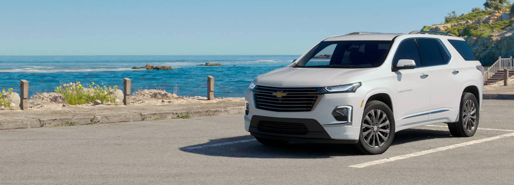 2023 White Chevrolet Blazer parked in front of a beach walk