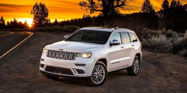Jeep Grand Cherokee Parked on Side of Road During Sunset
