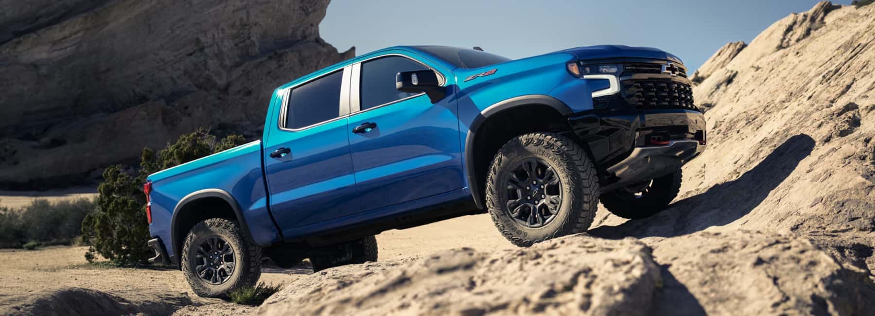 2026-Chevy-Silverado-parked-on-inclining-rocks