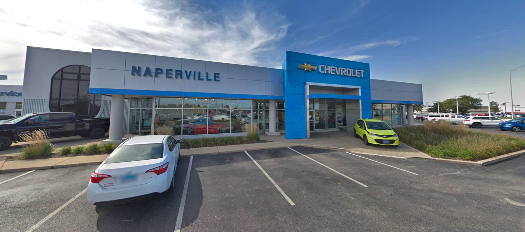 An exterior shot of a Chevrolet dealership during the day