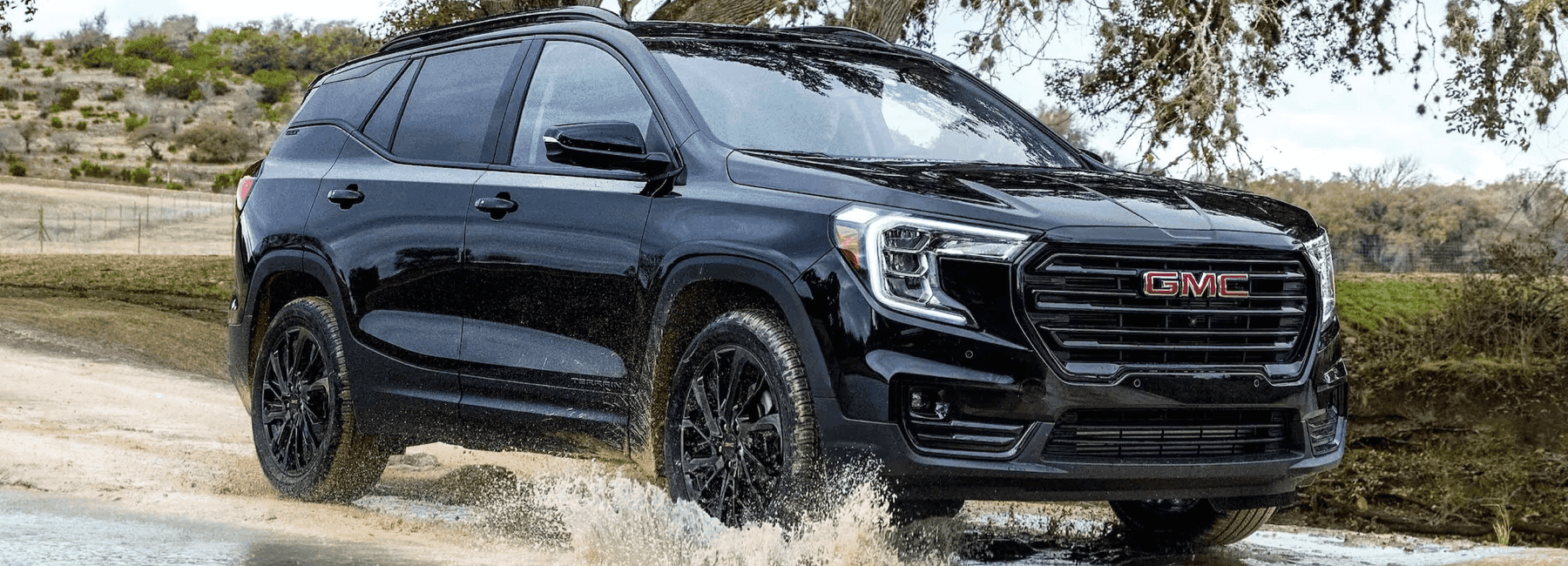 2023-GMC-Terrain-drives-through-sandy-puddle
