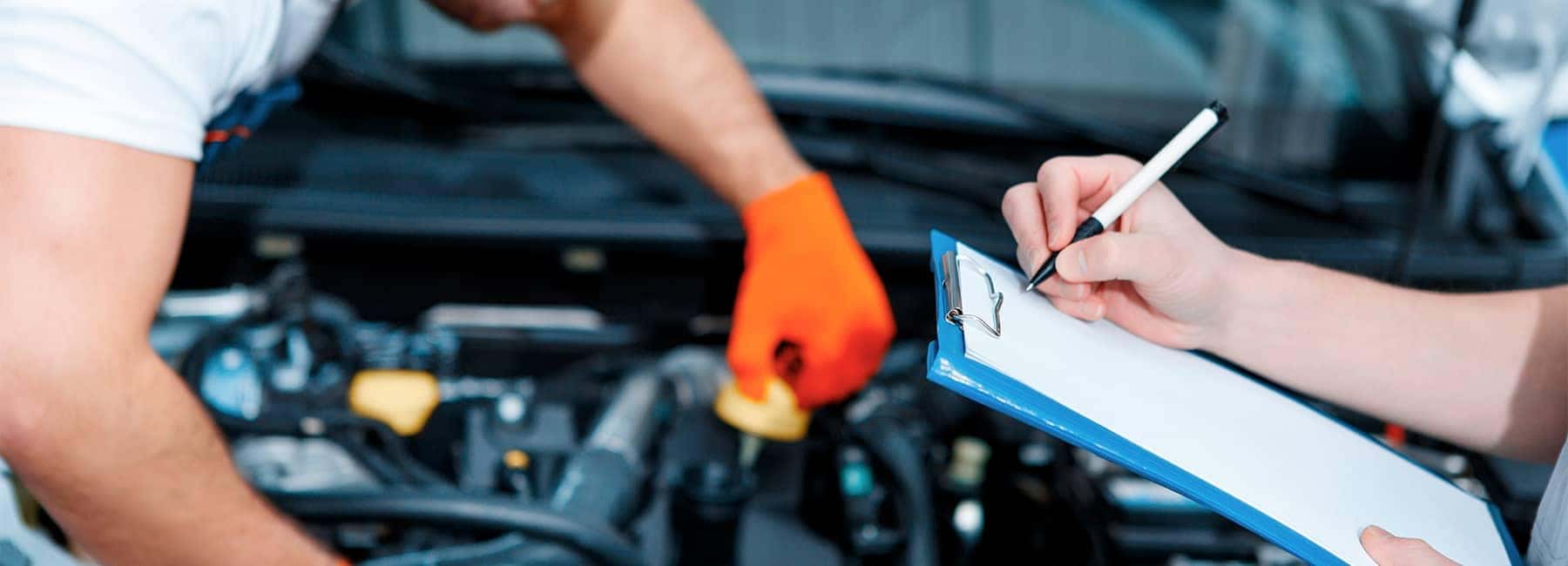Car mechanics at the service station