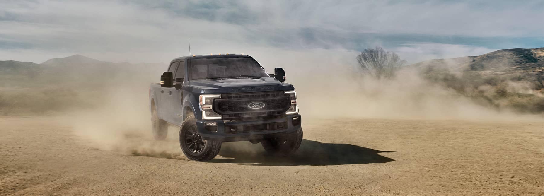 Ford truck with dust cloud