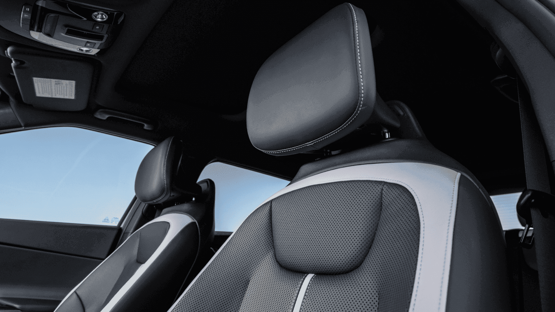 2025 Kia EV6 front seat with sporty two-tone upholstery and contrast stitching, showcasing modern comfort and interior craftsmanship.