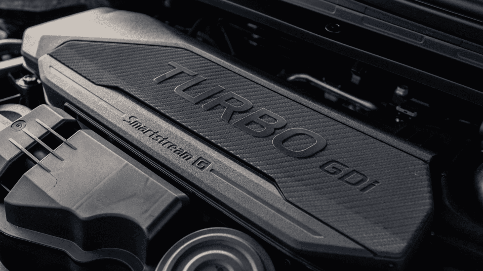Close-up view of the 2025 Kia K4 Smartstream G turbocharged GDI engine for enhanced performance and efficiency