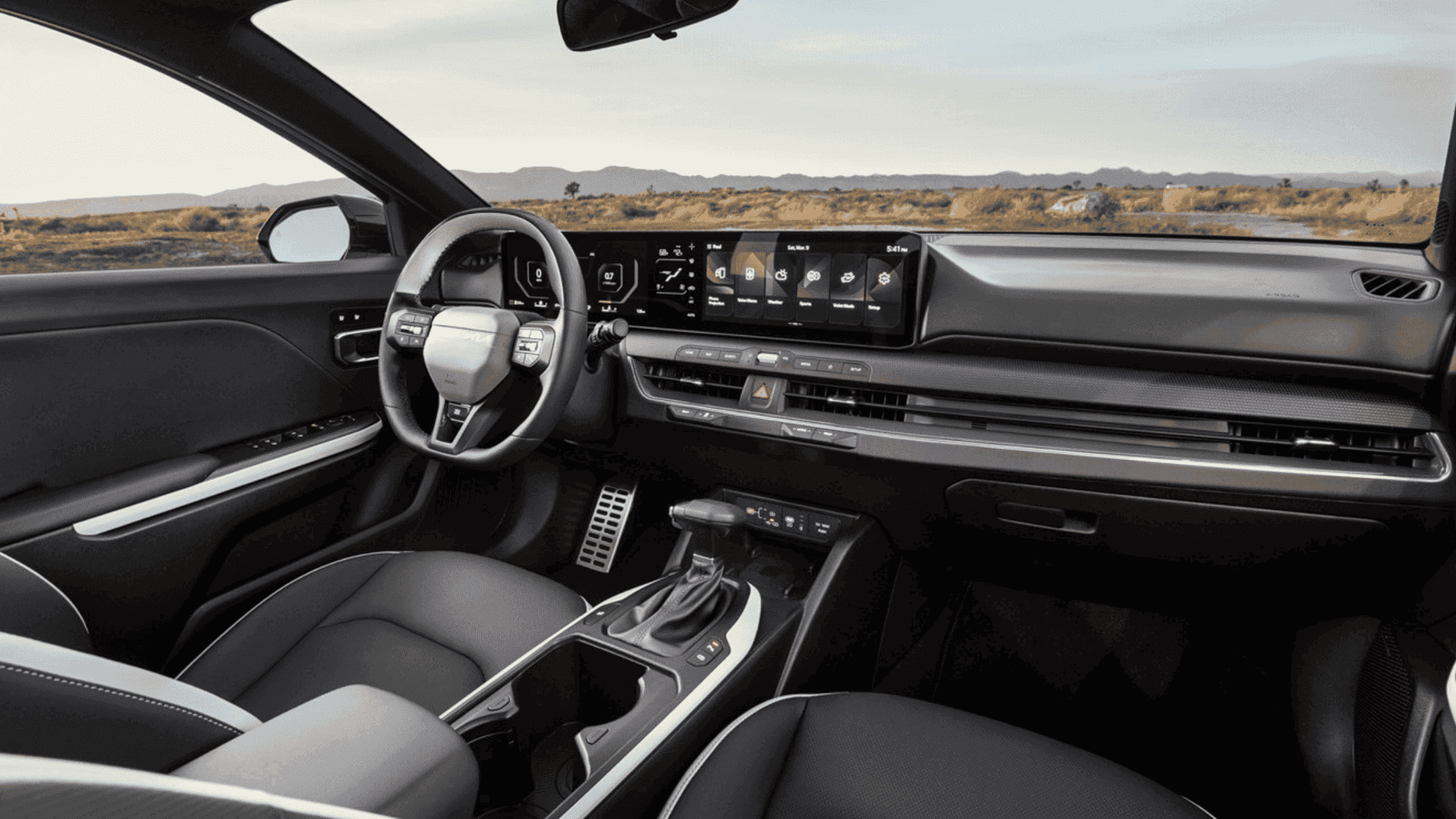Modern interior of the 2025 Kia K4 showcasing digital dashboard, touchscreen infotainment system, and premium driver controls