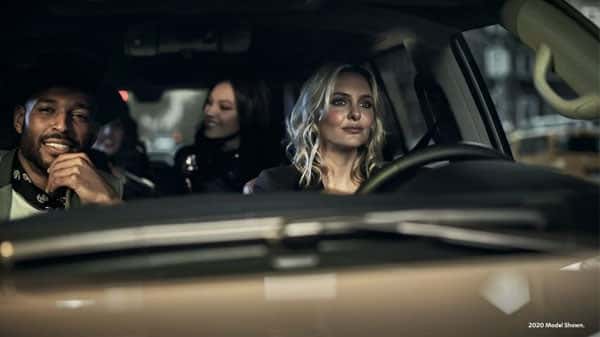 Woman driving with people in the vehicle