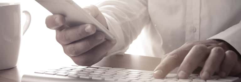 Hand typing on keyboard
