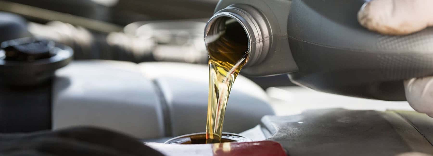 pouring oil in engine
