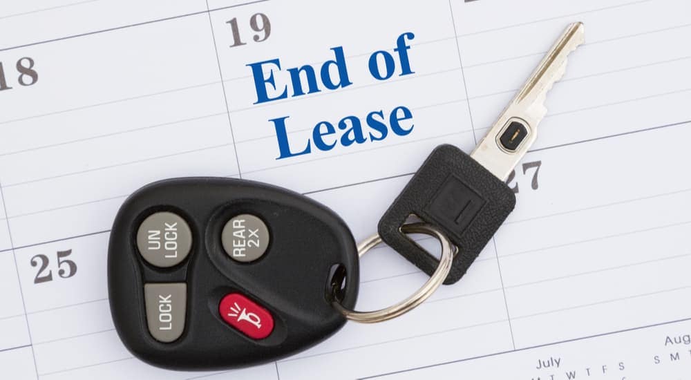 A car key is shown on a calendar marked for a GM lease turn in.