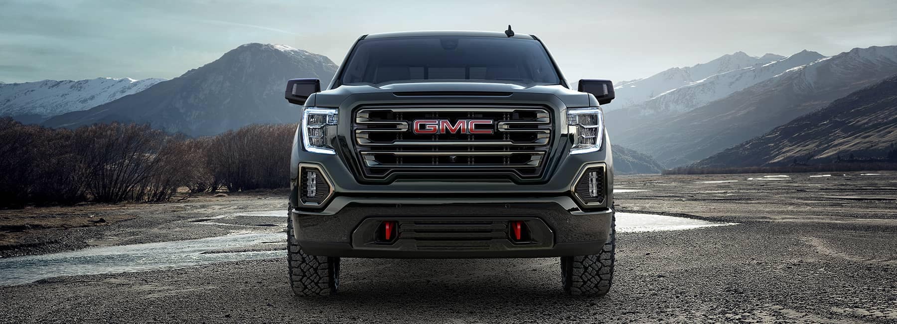 Onyx Black 2022 GMC Sierra 1500 with a mountain background_mobile