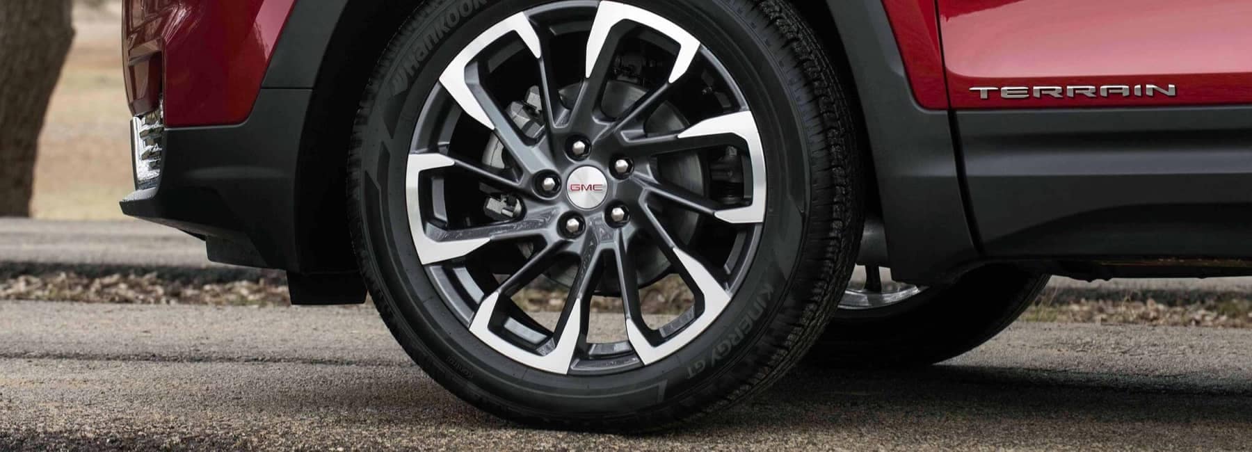 Closeup On Rims and Tires on the Red GMC Terrain SLT