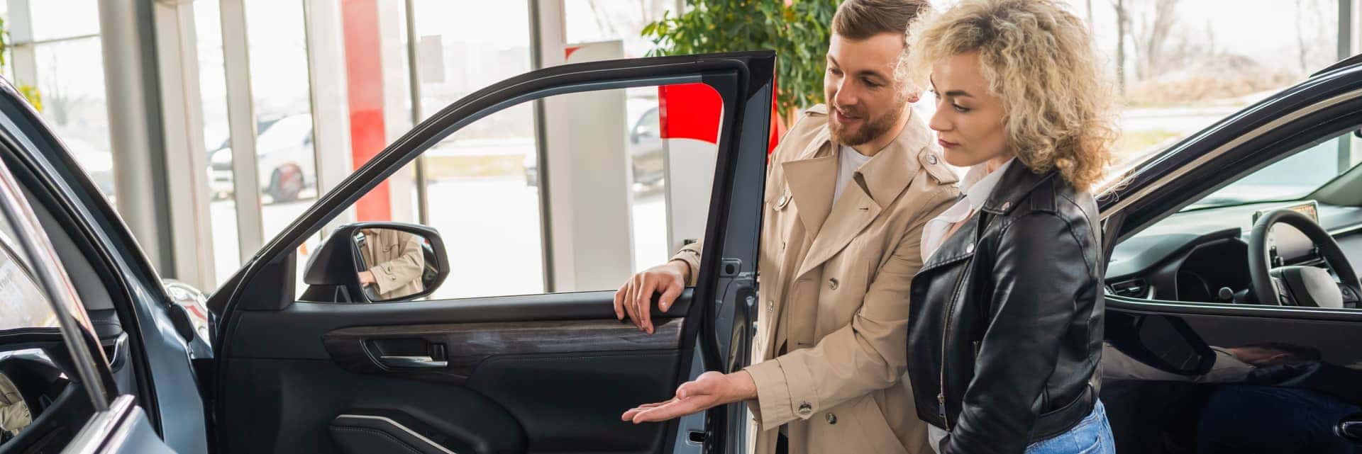 couple looking at a new vehicle