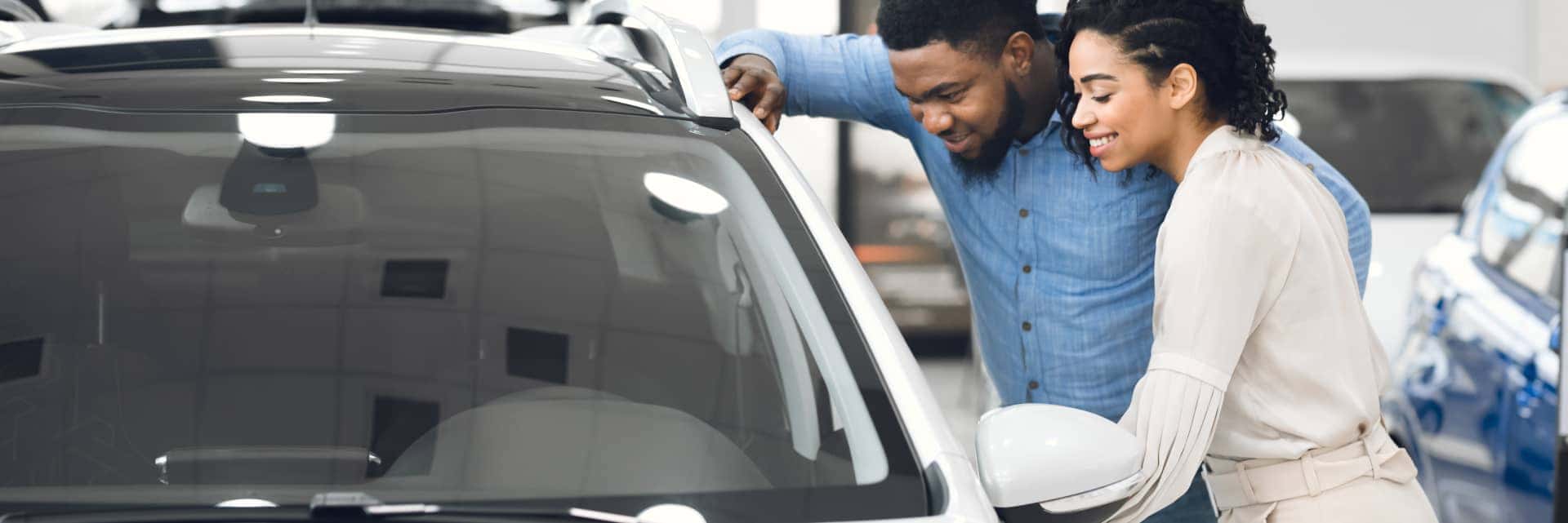 couple looking at a new vehicle