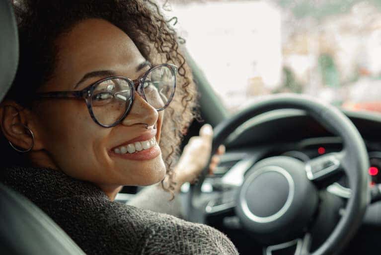 woman looking back in vehicle