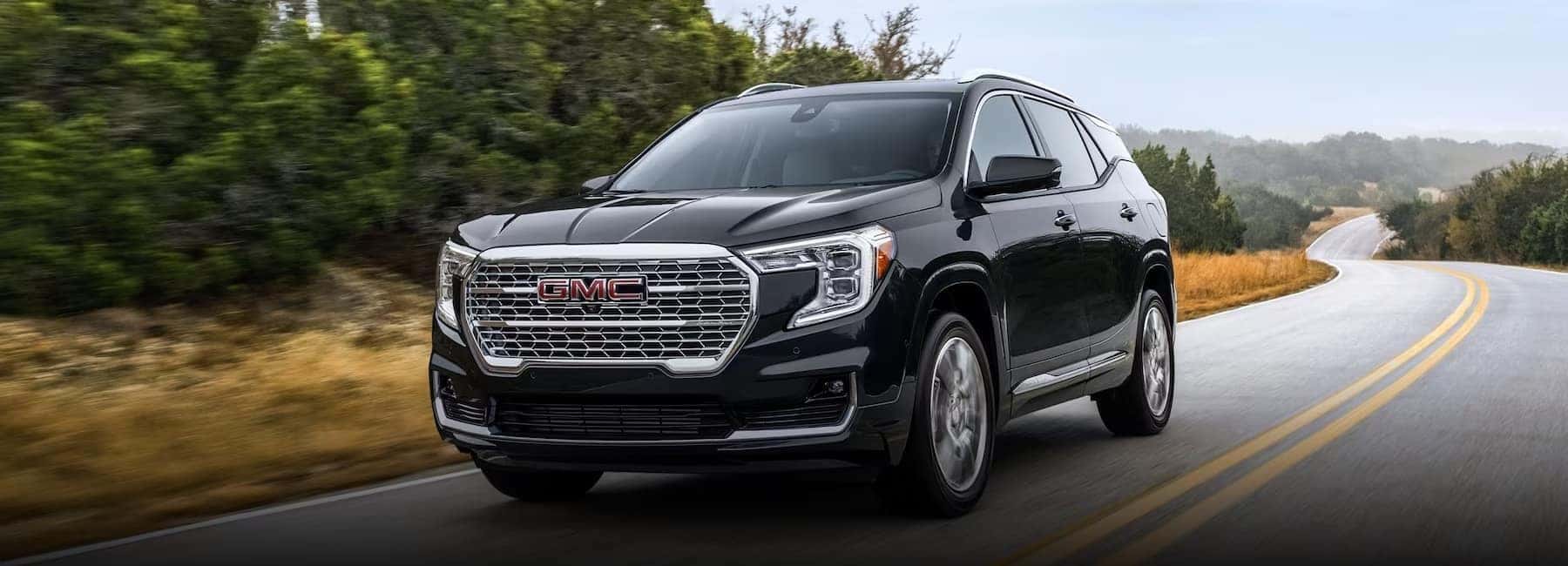 2024-gmc-terrain-denali-drives-highway