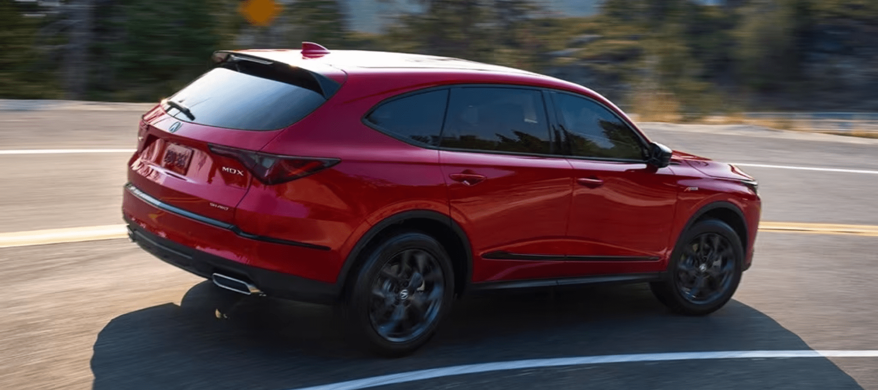2023-Acura-MDX-turns-highway-curve