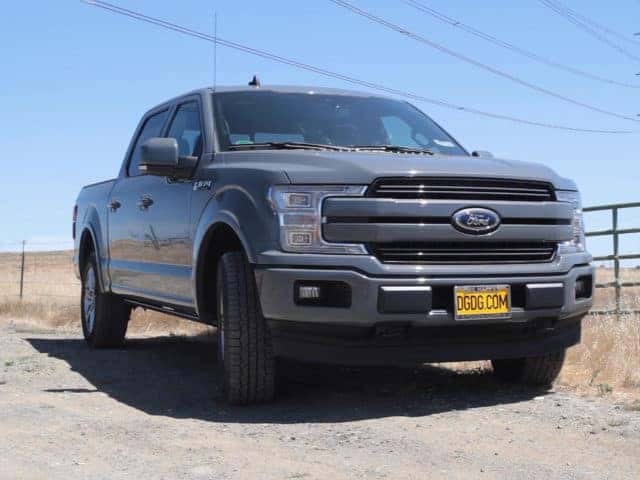 Ford truck parked on a field.