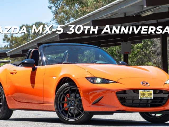 30th Anniversary Mazda MX-5 Miata parked in front of solar panels