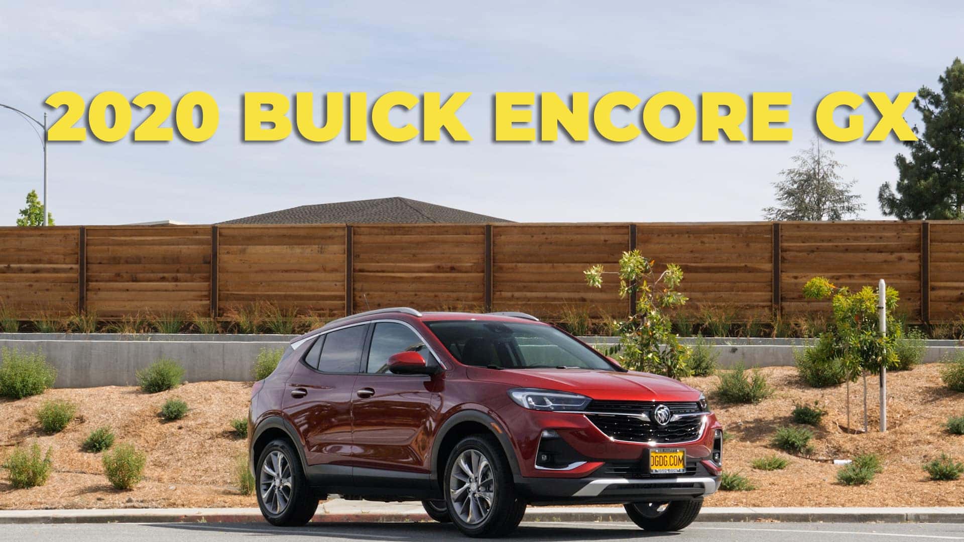 2020 Buick Encore GX parked in front of a fence.