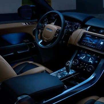 2020 Land Rover Range Rover Sport Interior Front Seating and Dashboard at Night