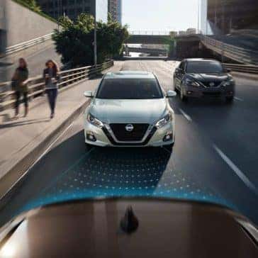 2019 Nissan Altima models shown approaching from rear on street