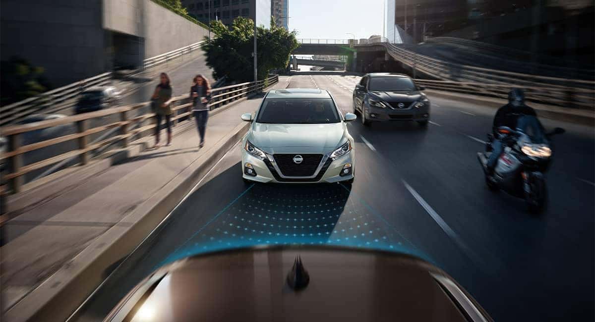 2019 Nissan Altima models shown approaching from rear on street