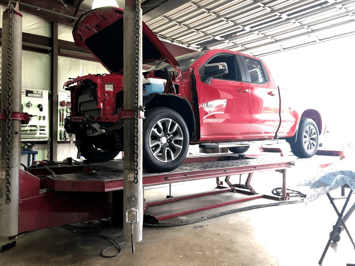 Damaged_Red_Truck_Awaiting_Repair