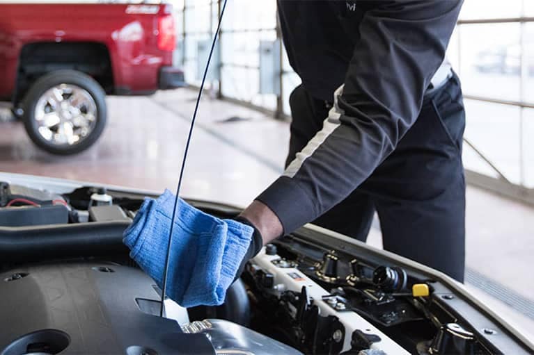 GM Certified Service Technician Checking Oil