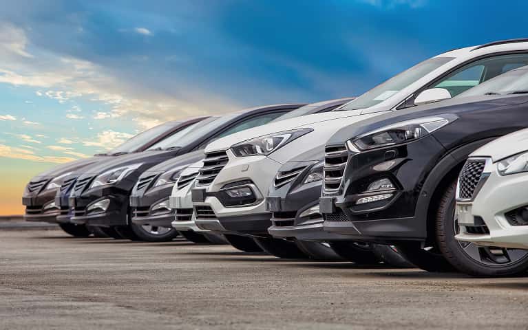 Used vehicles lined up in a row.