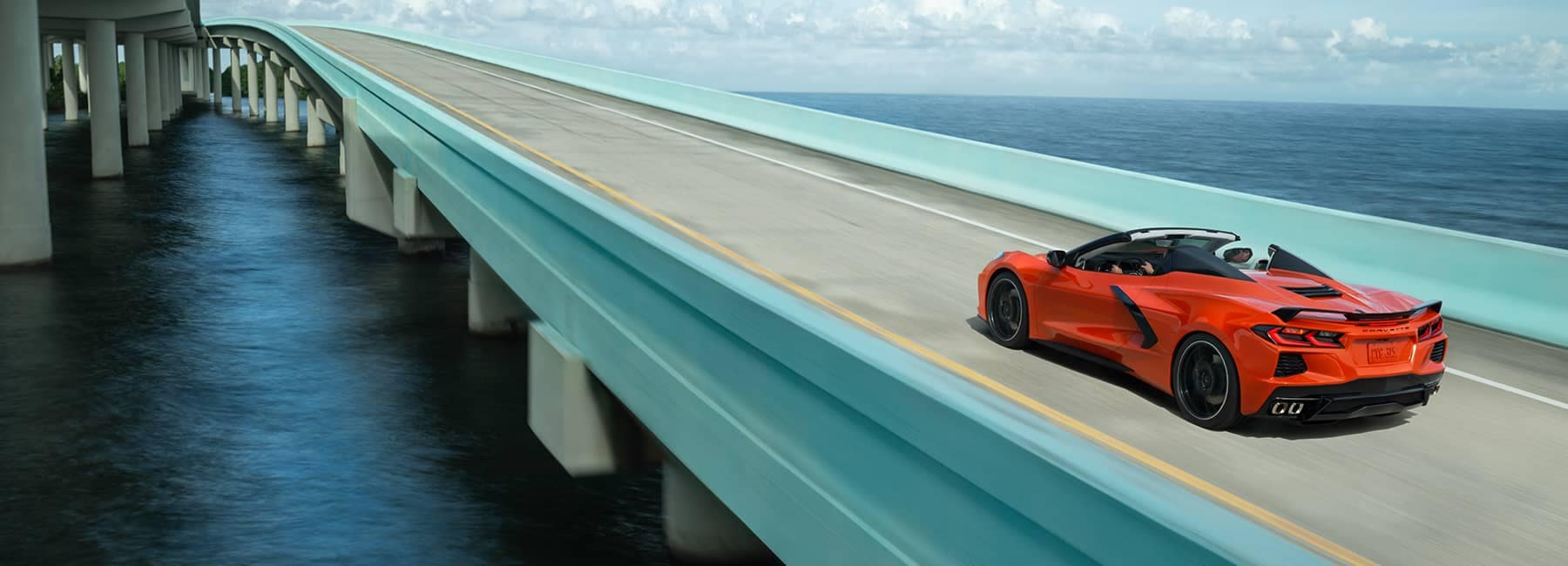 Red 2020 Chevrolet Corvette Stingray Convertible Driving on an Ocean Highway_mobile