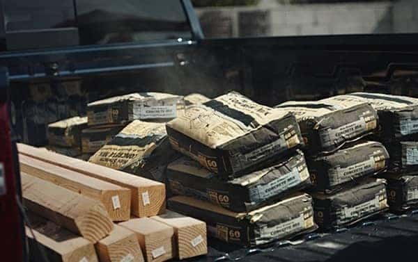 concrete and wood in bed of 2020 Chevy Silverado