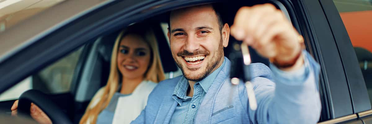 man holding car keys