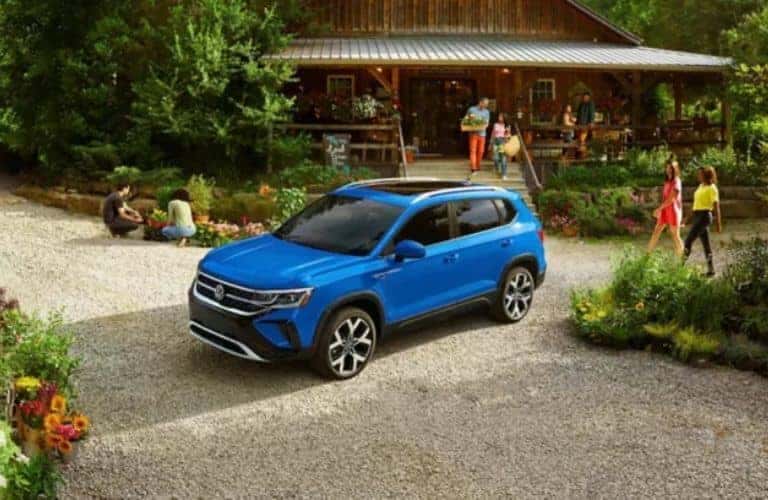 2023_VW_Taos_Front_parked_outside_with_people_in_the_background_o