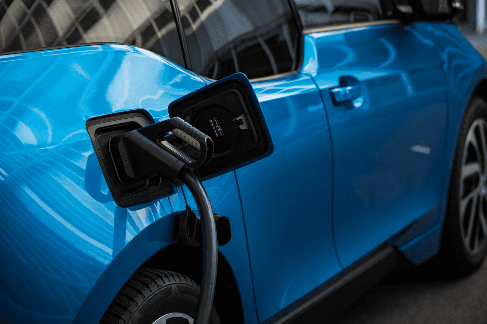 Blue EV car charging