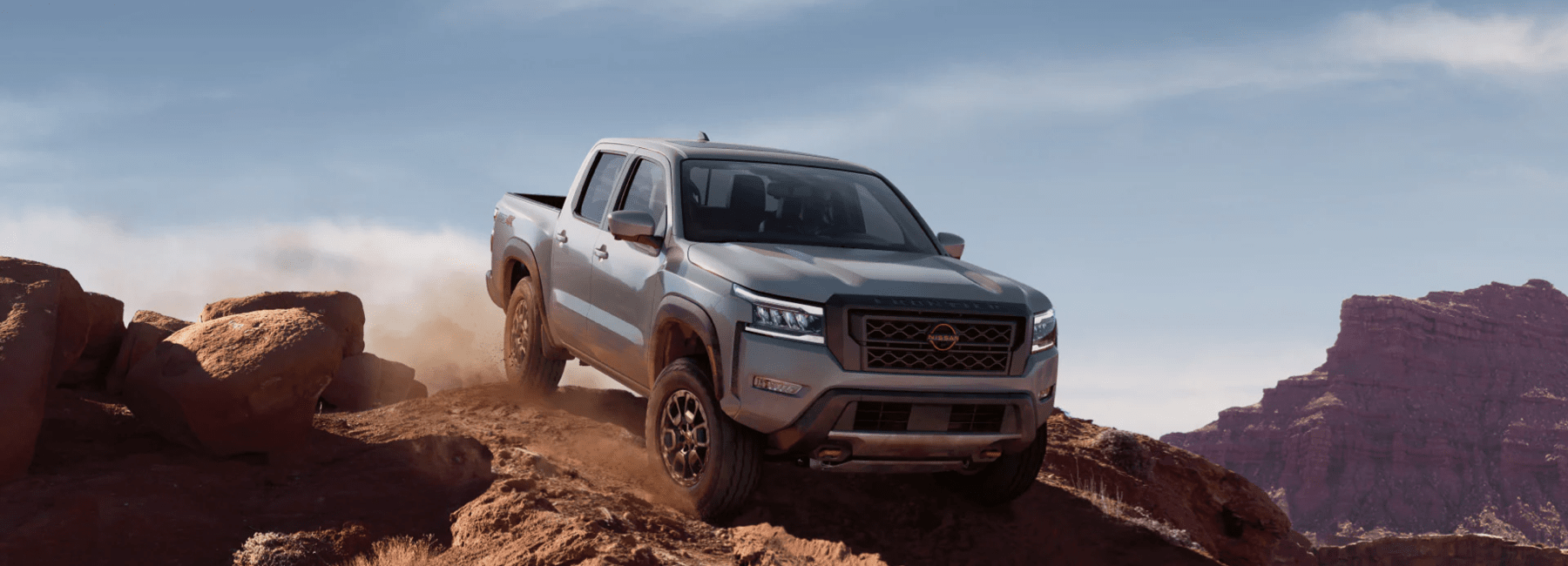 2023-nissan-frontier-on-dirt-mountain