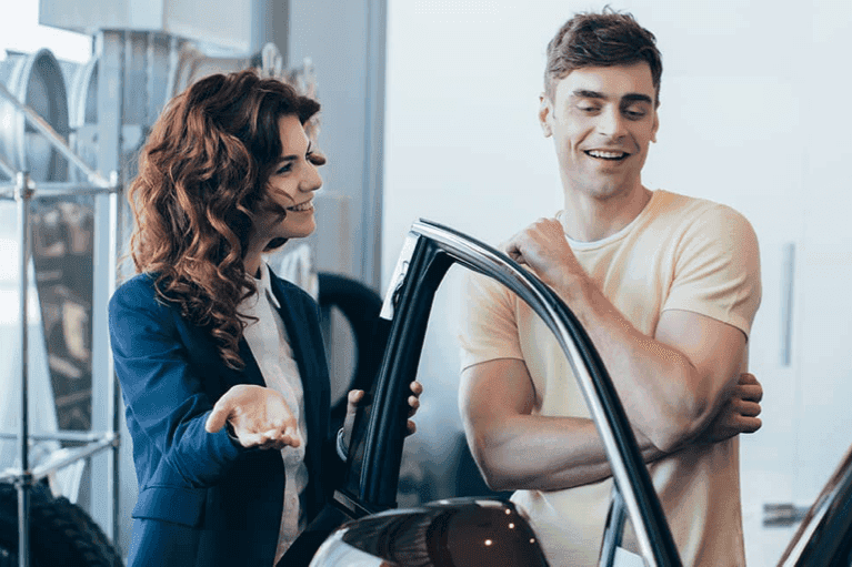 serviceperson-shows-man-his-car