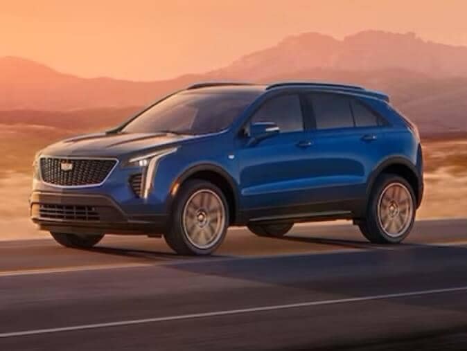 Cadillac XT4 with mountain sunset in background