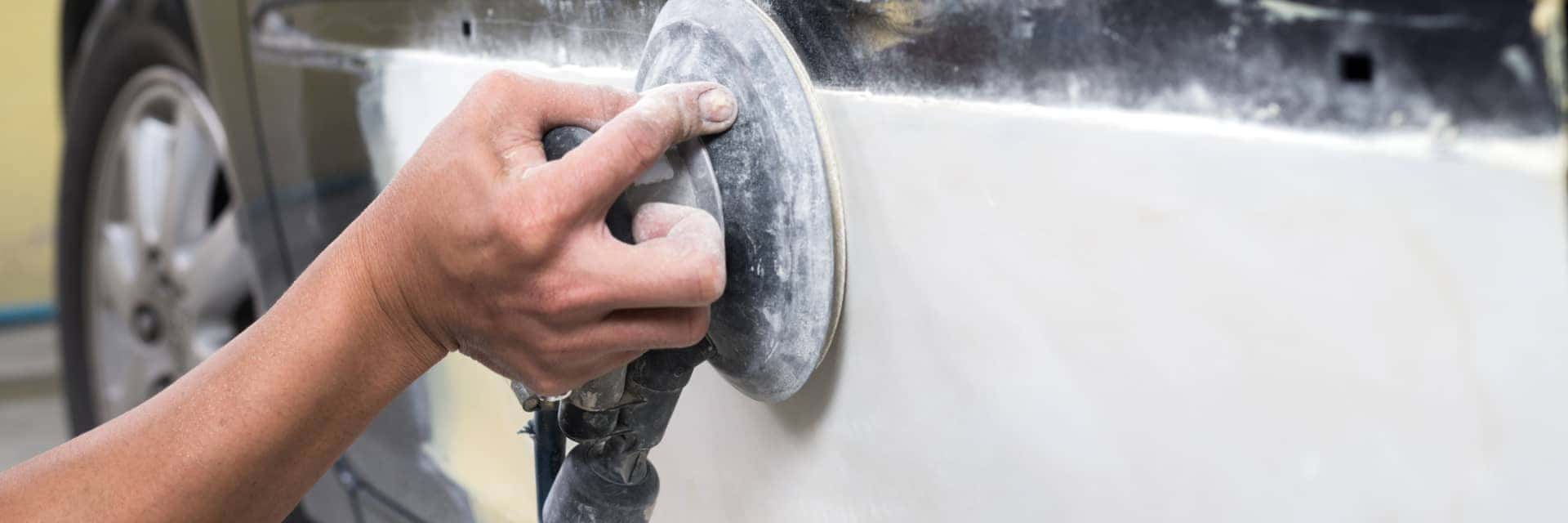 Chevrolet-technician-rotating-the-tires-on-a-vehicle